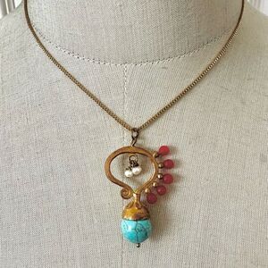 Gold tone red and blue beaded Tiklari pendant necklace